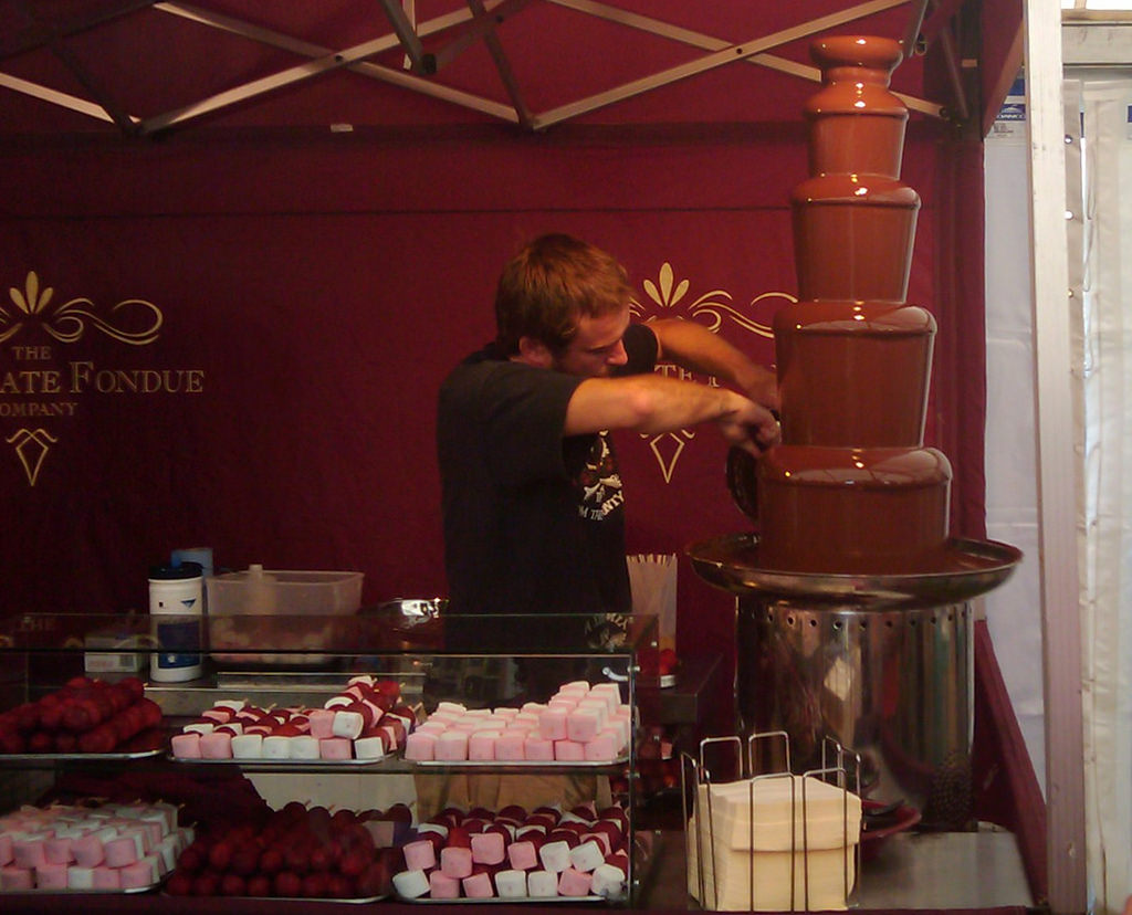 Man maintaining a chocolate fountain