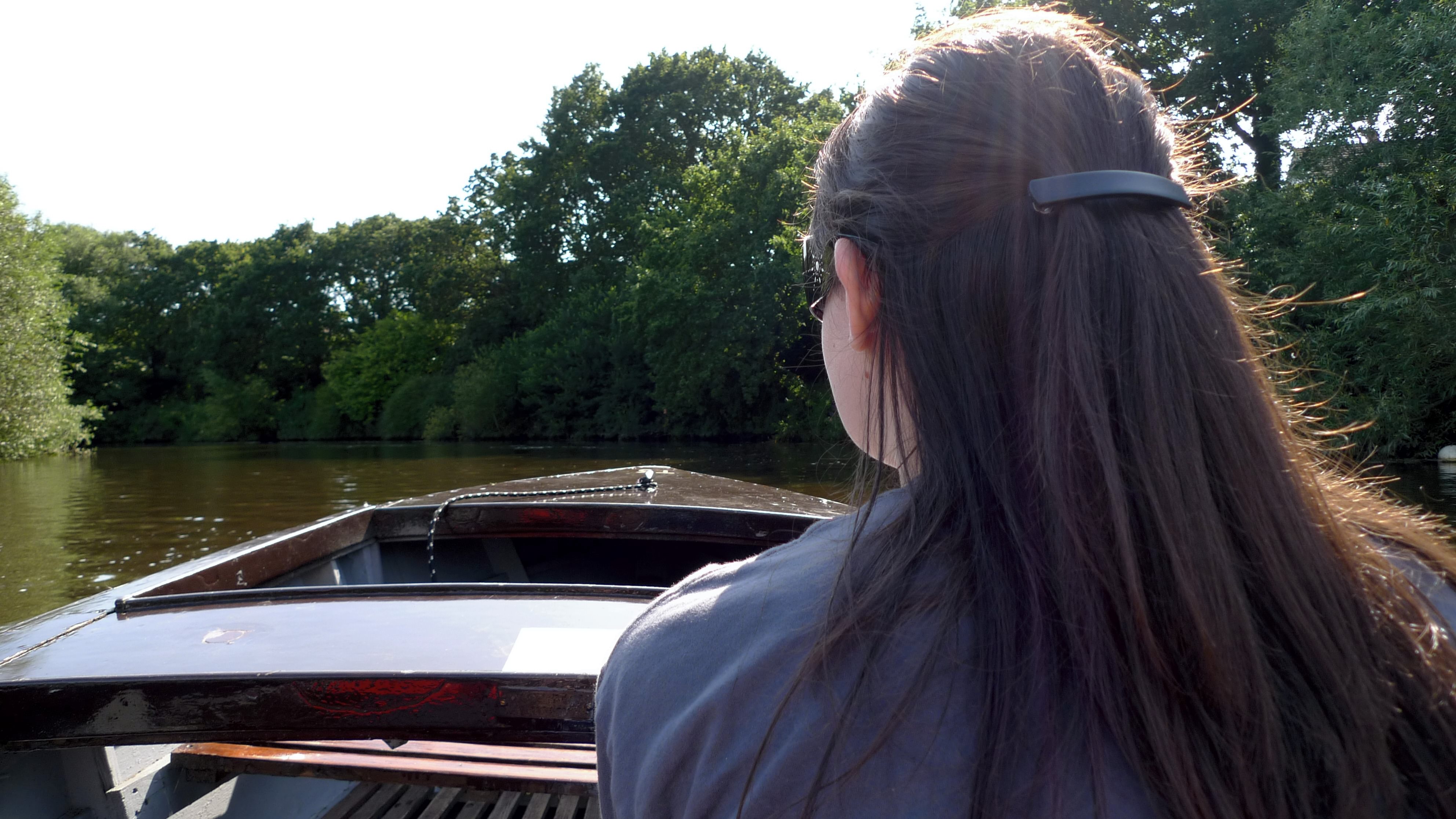 Christine in a boat on the river