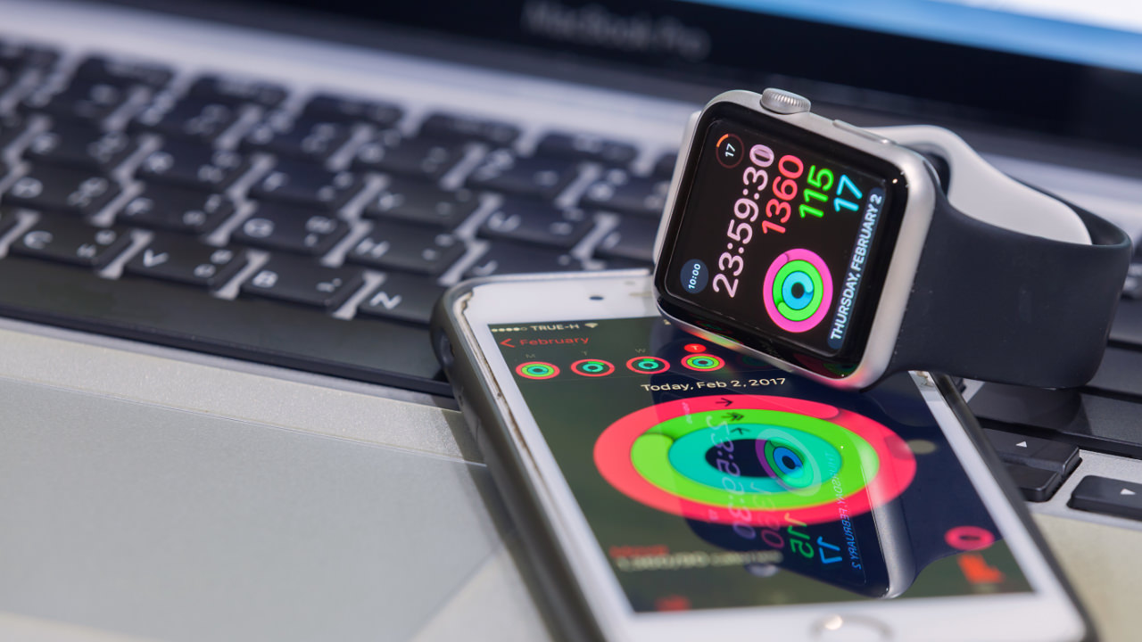 Apple Watch and Phone showing activity data
