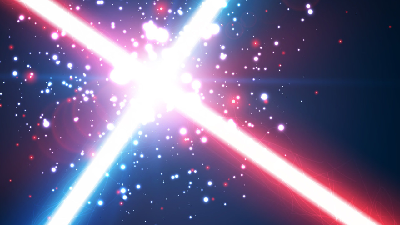 Two light sabers - red and blue - crashing together with sparks flying