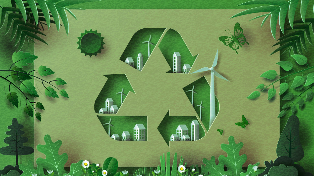 A paper cut out of the recycling logo