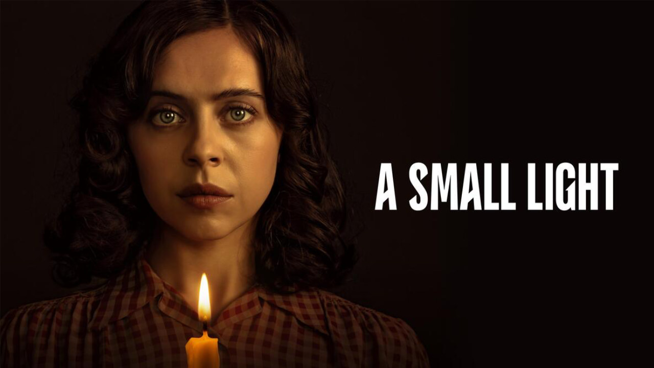 The marketing poster for A Small Light, featuring Bel Powley as Miep Gies holding a lit candle