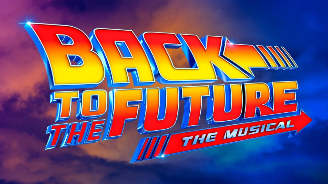 The marketing image for Back to the Future The Musical, featuring purple and blue clouds in the background, with the title stylised in red and yellow in the centre