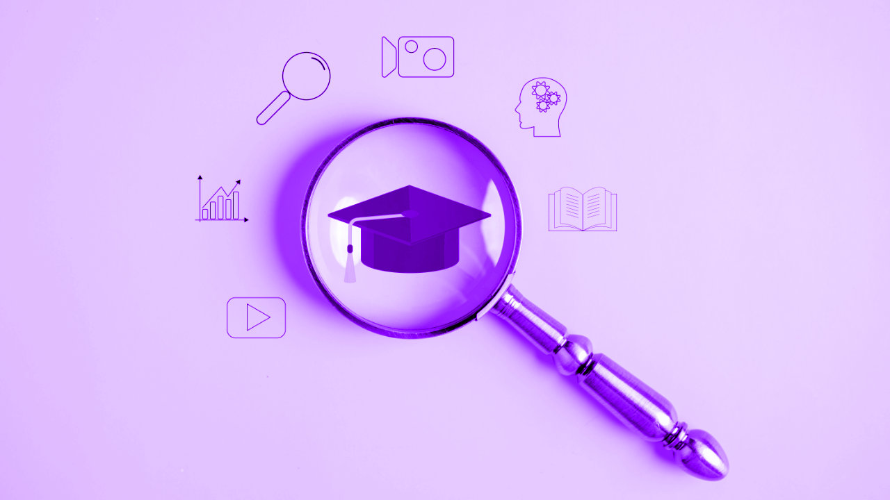 An illustration of a magnifying glass highlighting a scholar’s cap, with several icons surrounding the circular lens - a play button, a graph, a magnifying glass, a video camera, a head with cogs in the brain area, an open book