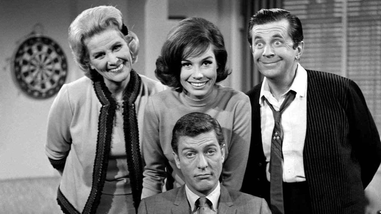 A black and white promotional image for the Dick Van Dyke Show featuring the main four characters smiling at the camera and pulling faces