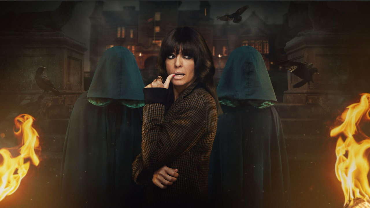 Marketing image for The Traitors featuring Claudia Winkelman in front of two hooded figures and the gothic castle setting