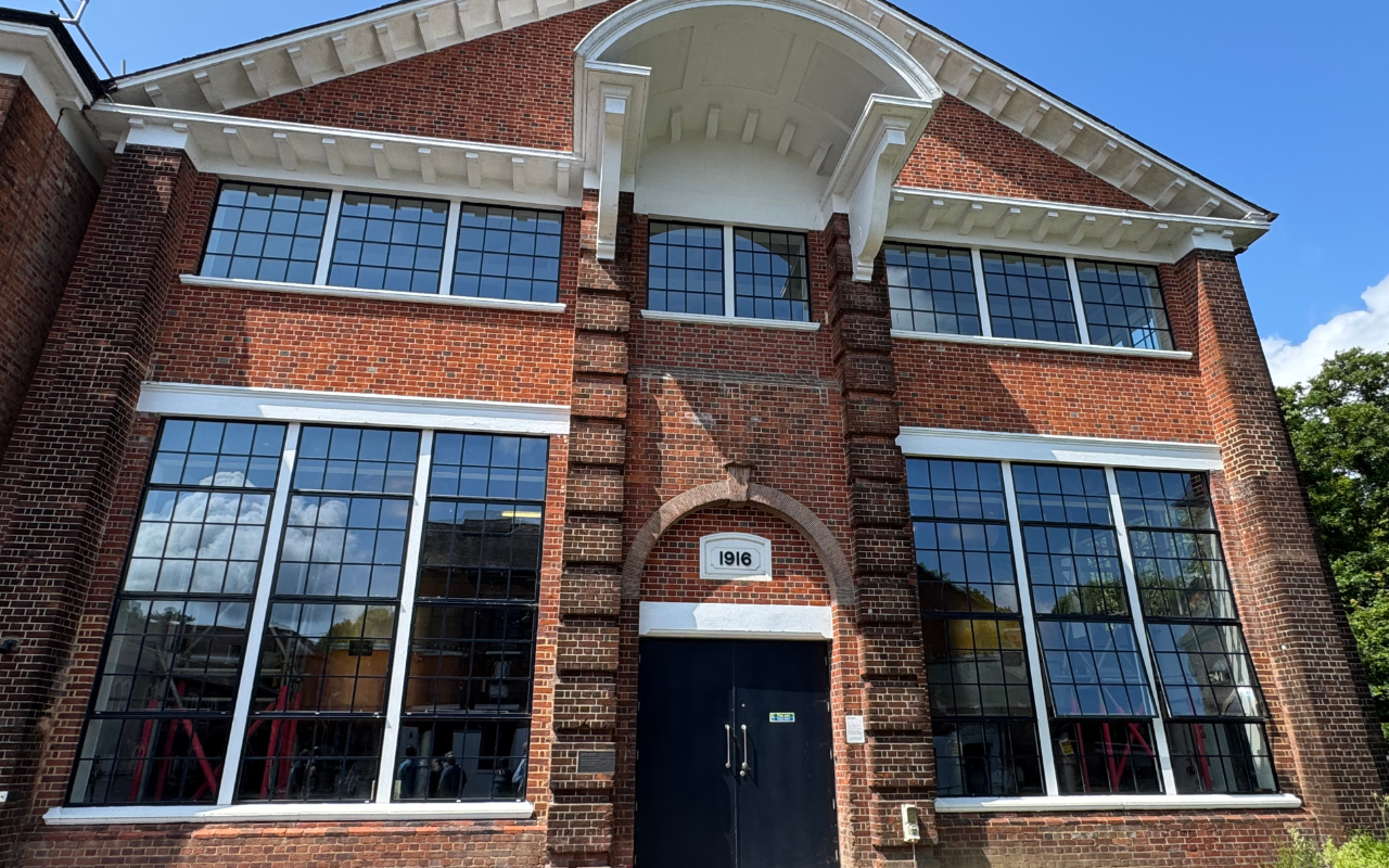 The main building at Bombay Sapphire which houses the two main stills, brick with white columns in a Colonial style
