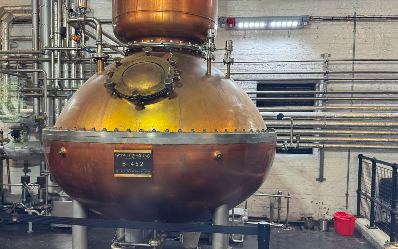 A copper gin still, rounded and bulbous